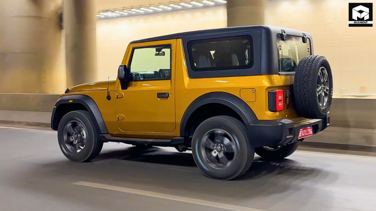 Get an exclusive first look at the 2025 Mahindra Thar 3-Door spotted at dealer yards ahead of its official launch. Discover features, specs, and expected pricing. - shot
