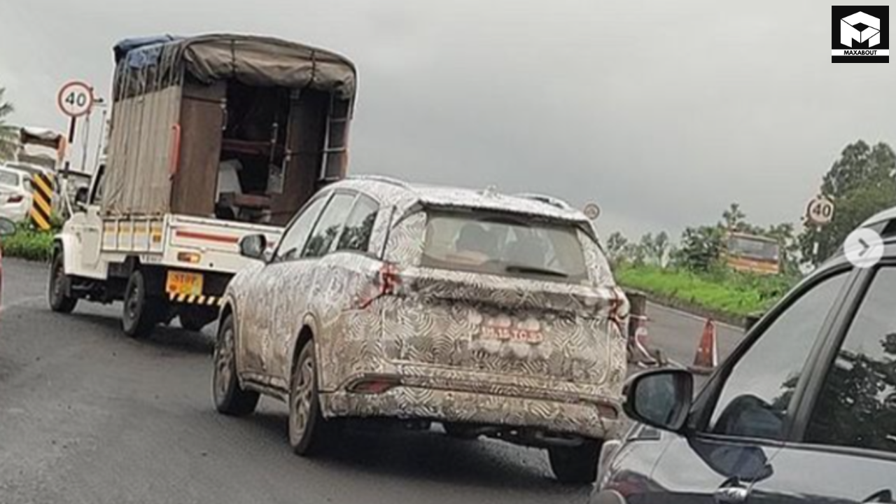 The upcoming Mahindra XUV700 facelift has been spotted testing in a convoy of 5 vehicles. Get the latest details on expected changes, features, and launch timeline. - bottom