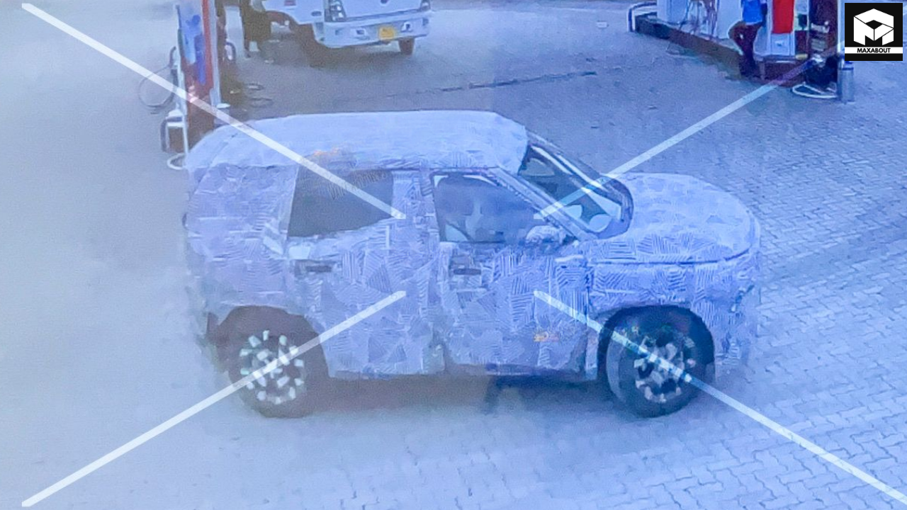 Tata Sierra petrol variant spotted at a fuel station confirms the upcoming SUV will have both petrol and electric powertrain options, reviving the iconic nameplate with modern tech. - background