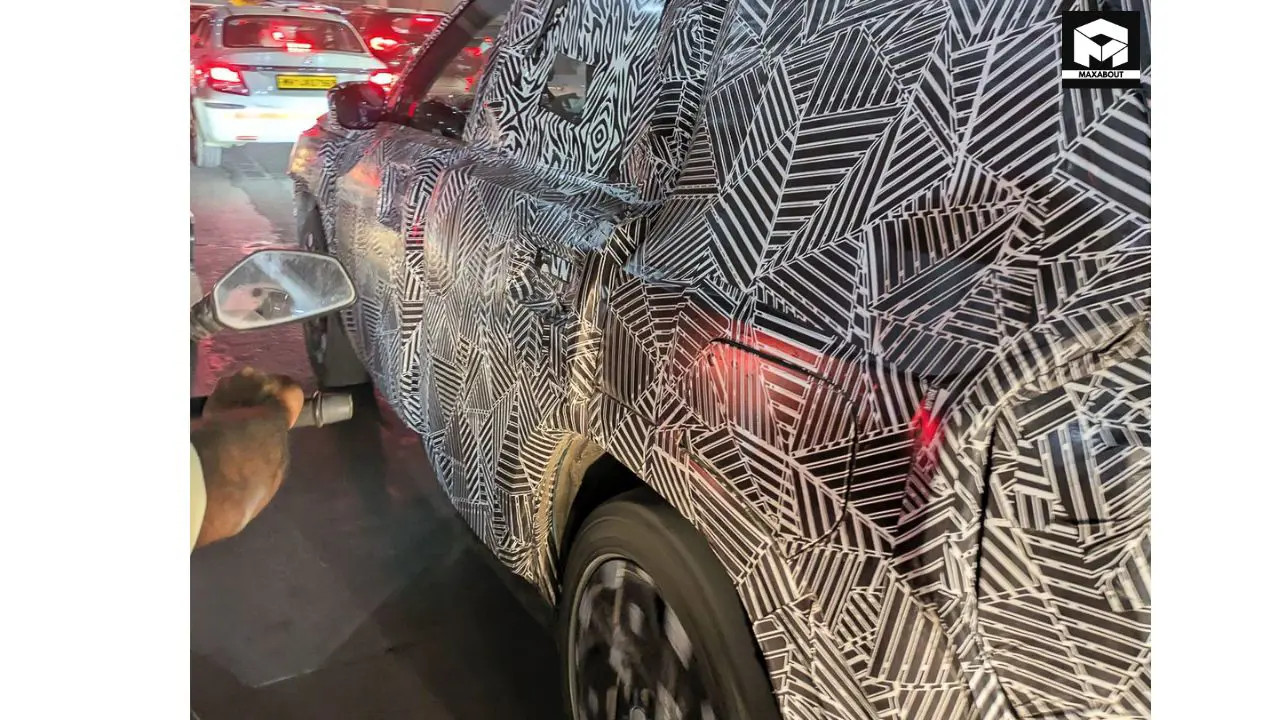 Get an exclusive look at the new Tata Sierra's interior featuring a triple screen layout, premium dashboard, and luxurious amenities that position it as a high-end SUV. - close up